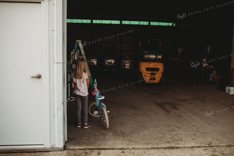 Farm Kid with Bicycle in Shop 4538