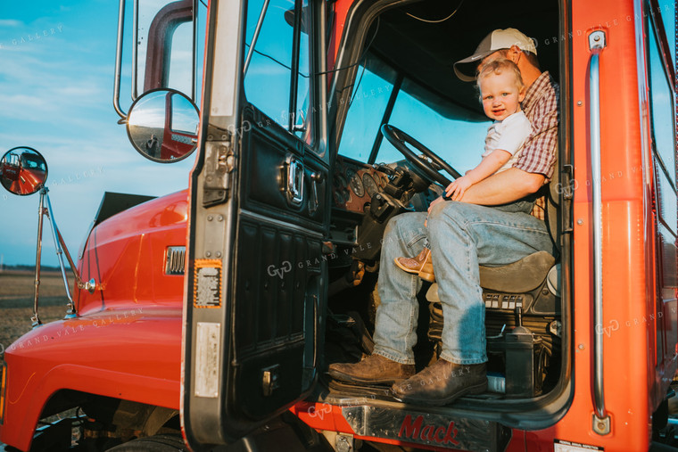 Farmer with Farm Kid in Semi Truck 4884