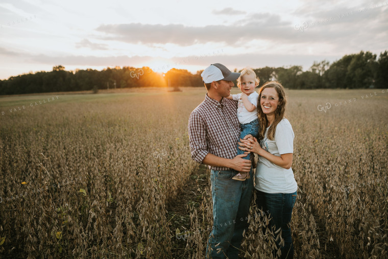 Farm Family Standing in Dried Soybean Field at Sunset 4970