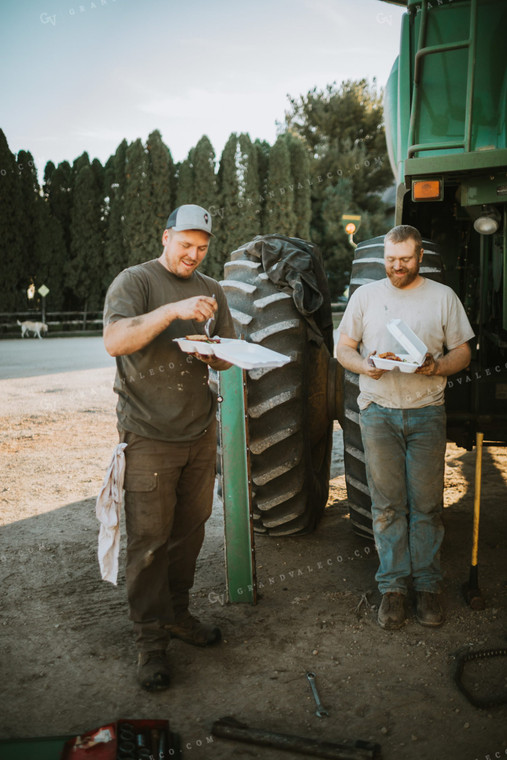 Farmers Eating Field Meals While Working on Combine 5057