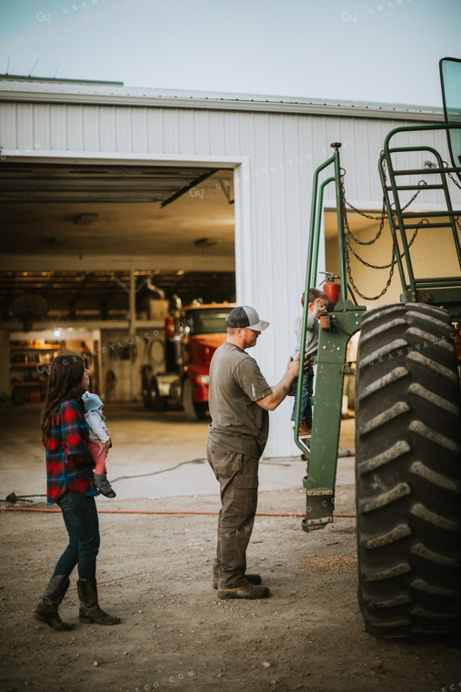 Farmer and Farm Kid Working on Combine 5121