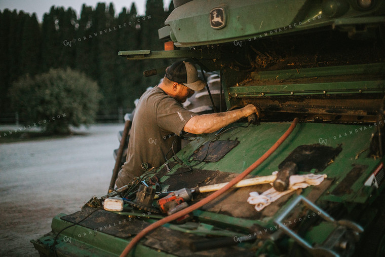 Farmer Working on Combine 5151