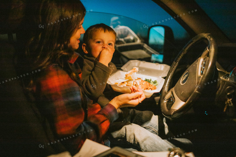 Farm Mom and Farm Kid Eating Field Meal in Truck at Night 5157