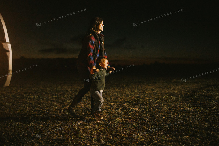 Farm Mom and Son Waiting for Tractor in Field at Night 5159