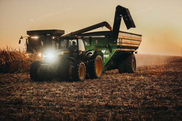 Combine and Auger Cart Harvesting Corn Field 5253