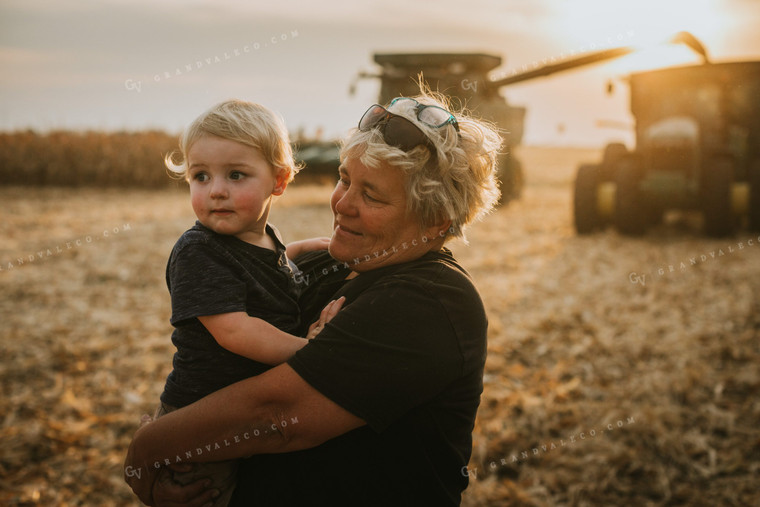 Farm Kid and Parent in Corn Field with Machinery 5268