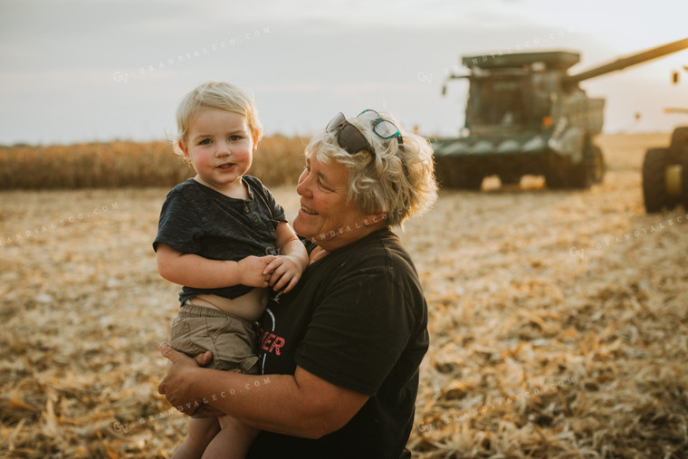 Farm Kid and Parent in Corn Field with Machinery 5269