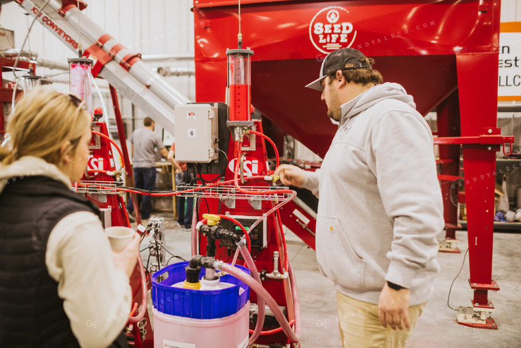 Man and Woman Monitoring Seed Treatment Chemical 5332