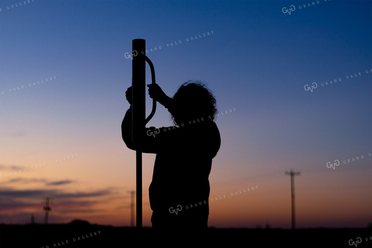 Farmer Pounding Fence Posts 50061