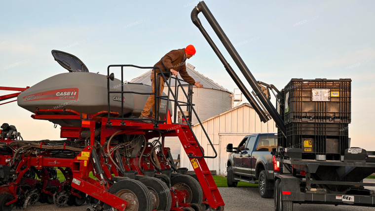 Farmer Climbing into Tractor Cab 25341