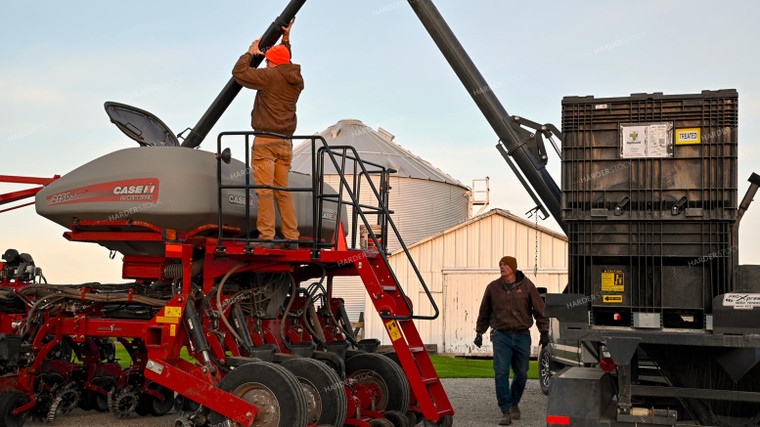 Farmer Climbing into Tractor Cab 25343