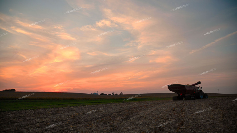 Grain Cart Driving at Sunset 25502