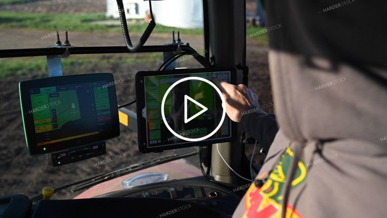 Farmer in the Tractor Cab with Technology - 049