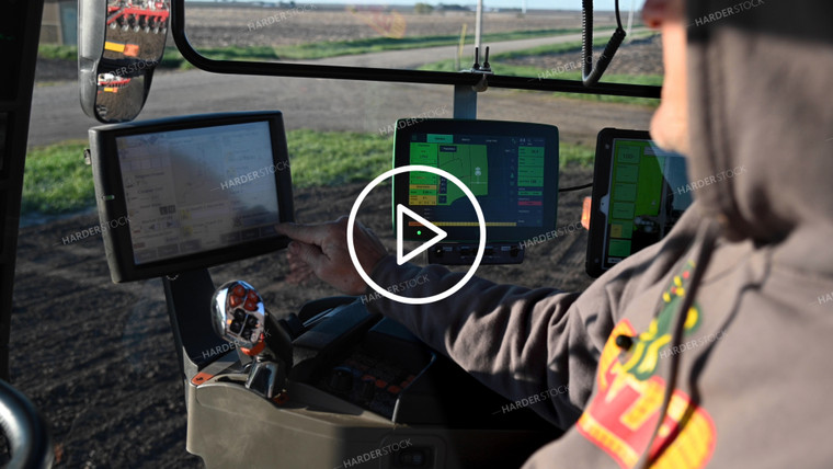 Farmer in the Tractor Cab with Technology - 050