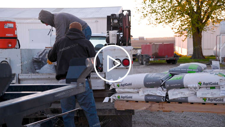 Loading Seed Bags into the Truck - 060