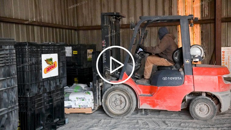 Loading the Seed Tender with a Skidsteer - 063