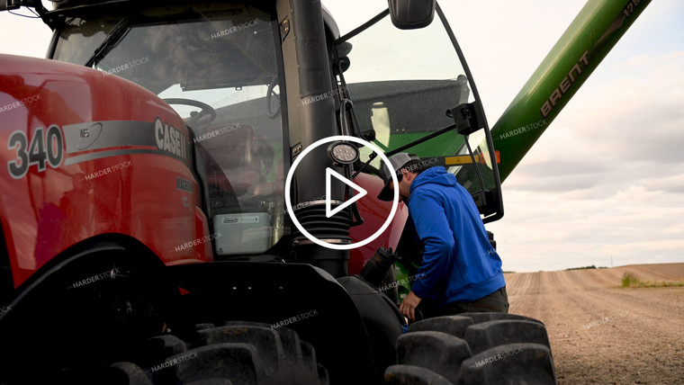 Farmer Climbing out of Tractor Cab - 497