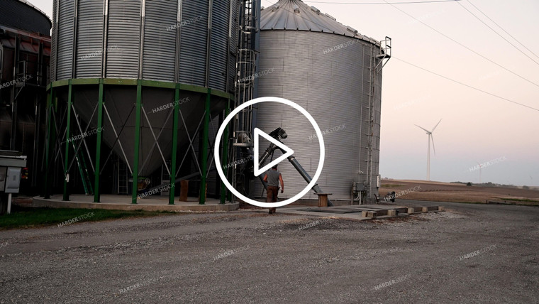 Farmer Working at Grain Bin Site during Harvest - 530