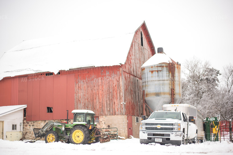 Red Barn with Farm Equipment in the Snow 74023