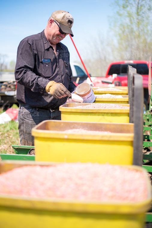 Farmer with Planter Seed Boxes 74046