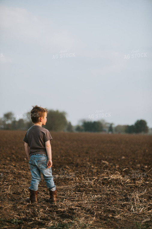 Farm Kid in Field During Planting 5628