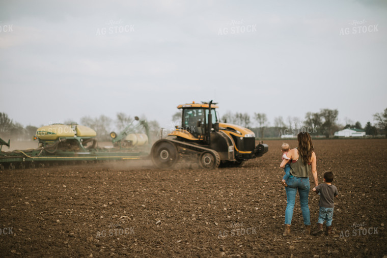 Farm Mom Taking Kids Out to Tractor During Planting 5637