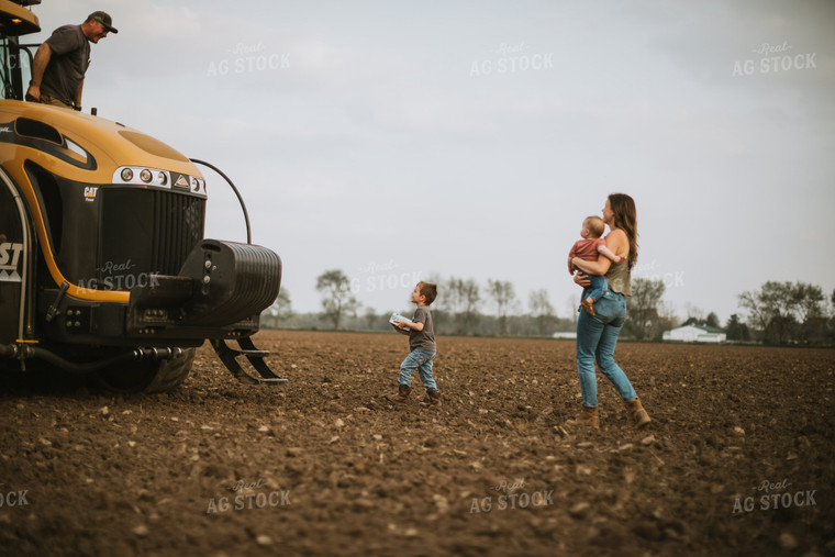 Farm Mom Taking Kids Out to Tractor During Planting 5639