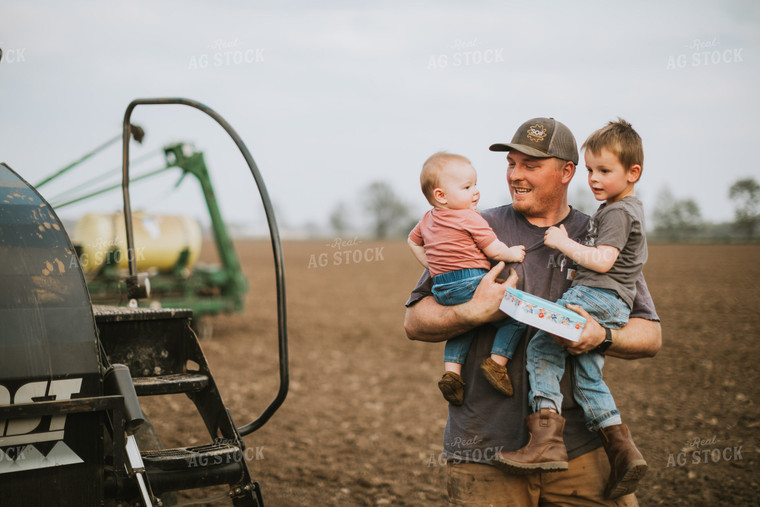 Farmer with Kids During Planting 5644