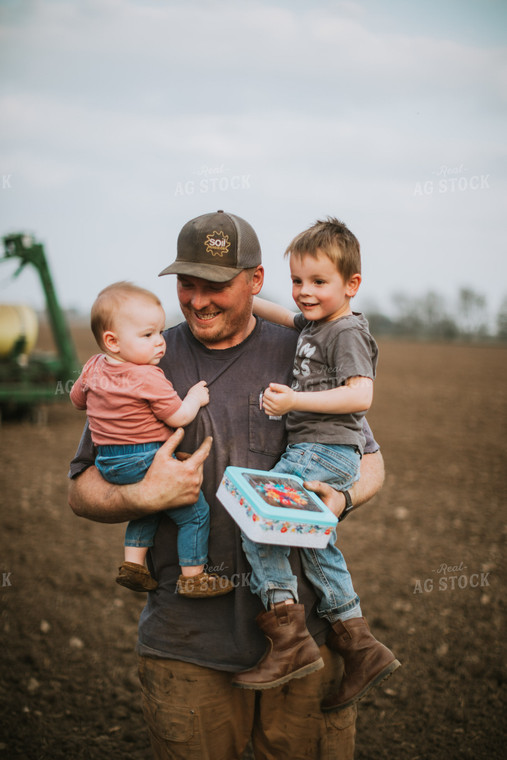 Farmer with Kids During Planting 5645