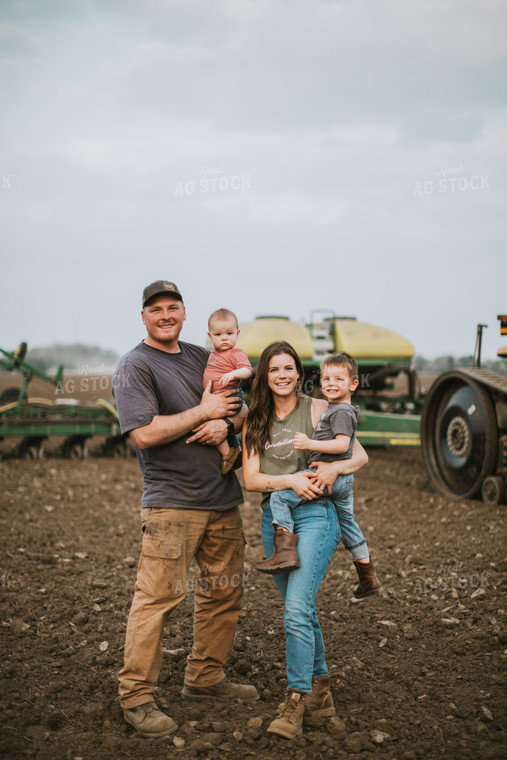 Farm Family in Field During Planting 5650