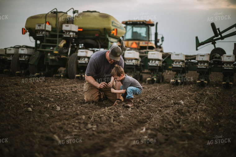 Farmer and Farm Kid Checking Seed Depth 5652