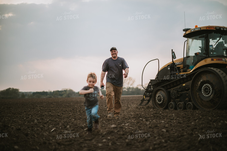 Farmer Walking Away From Planter Tractor with Farm Kid 5670