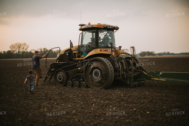 Farmer Walking Toward Planter Tractor with Farm Kid 5686