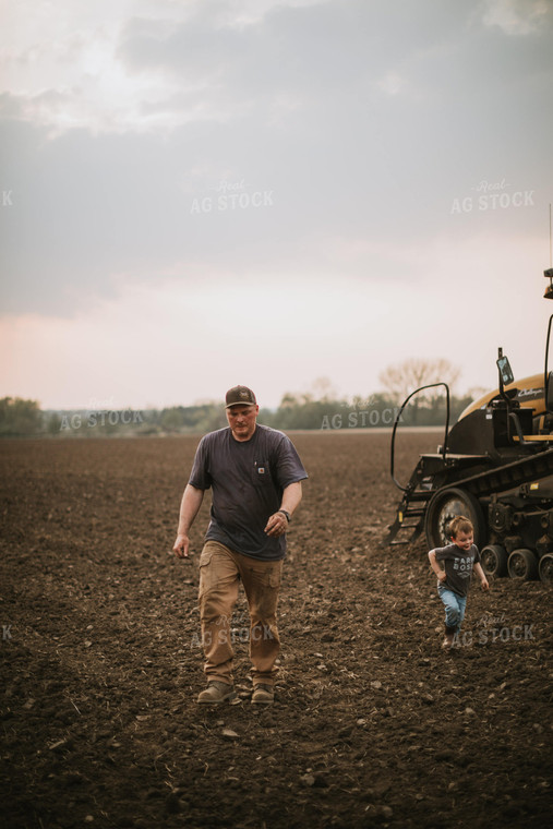 Farmer Walking Away From Planter Tractor with Farm Kid 5687