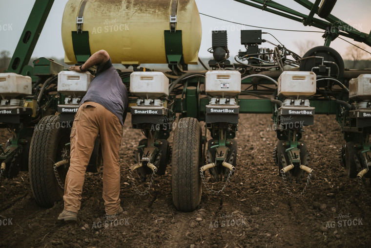 Farmer Adjusting Planter 5688