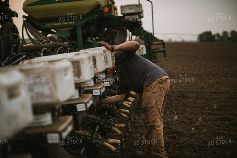 Farmer Adjusting Planter 5690
