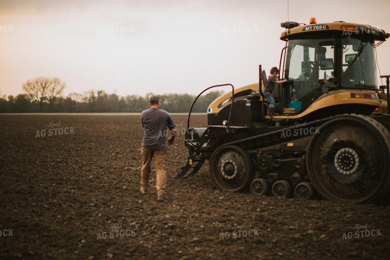 Farmer Walking Toward Planter Tractor with Farm Kid 5696