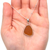 Honey Amber Sea Glass Single Bezel Necklace on model for color reference.