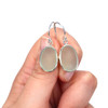 Seafoam Oval Sea Glass Single Bezel Earrings on model for color reference.