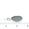Gray Oval Sea Glass Single Bezel Necklace on ruler for size reference.