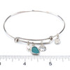 Aqua Sea Glass Sand dollar and Pearl Sea Glass Adjustable Bangle Bracelet on ruler for size reference.