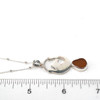 Amber Sea Glass Stallion Necklace on ruler for size reference.