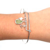 Seafoam Bright Sea Glass Adjustable Anchor Charm Bangle Bracelet on model for color reference.