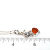 Orange Sunset Sea Glass Double Pumpkin Necklace on ruler for size reference.