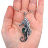 Turquoise Tropical Ultra Rare Sea Glass Seahorse Necklace  on palm for color reference