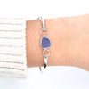 Cornflower Gumdrop Sea Glass Bezel Bangle Bracelet on model for color reference.