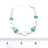 Aqua and Seafoam Sea Glass Shimmer Beaded Bracelet on ruler for size reference.