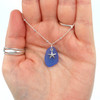 Cornflower Sea Glass and Petite Starfish Charm Necklace in hand for color reference