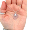 Lavender Breeze Sea Glass and Petite Sand Dollar Charm Necklace in hand for color reference