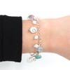 Lavender Icy Blues Sea Glass and Shiva Shell Charm Bracelet on model for color reference.